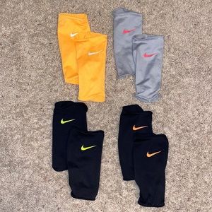 NIKE MEDIUM/LARGE (NEON ORANGE/BLACK/GREY) SHIN GUARD KEEPERS
